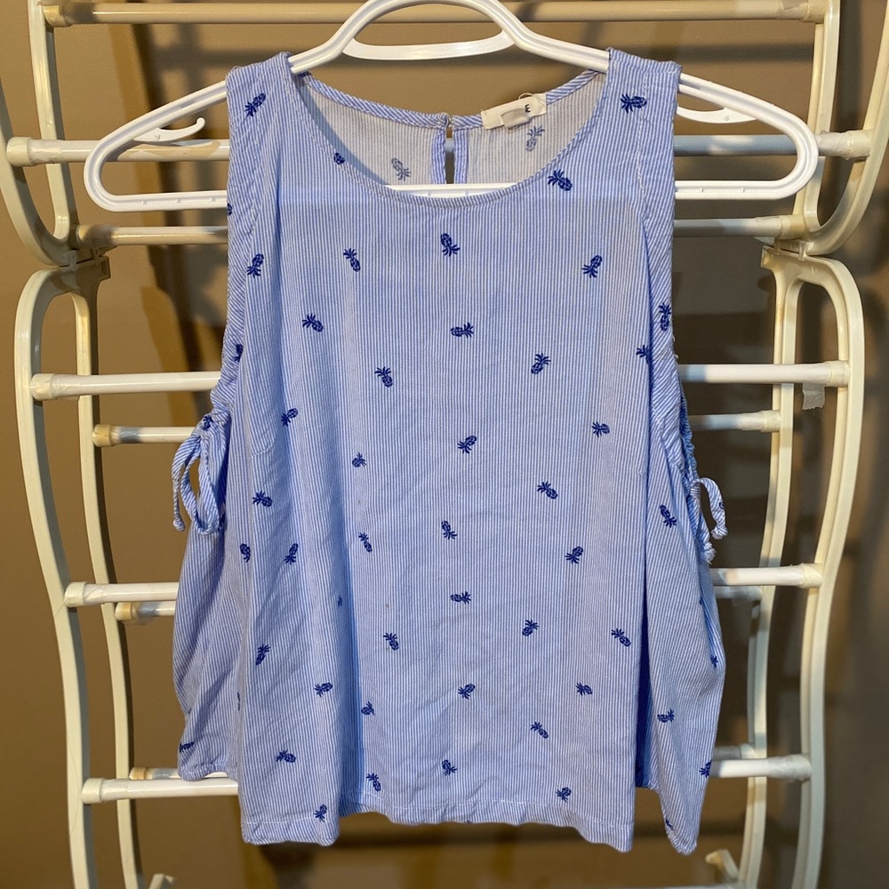 A blue cold shoulder top
